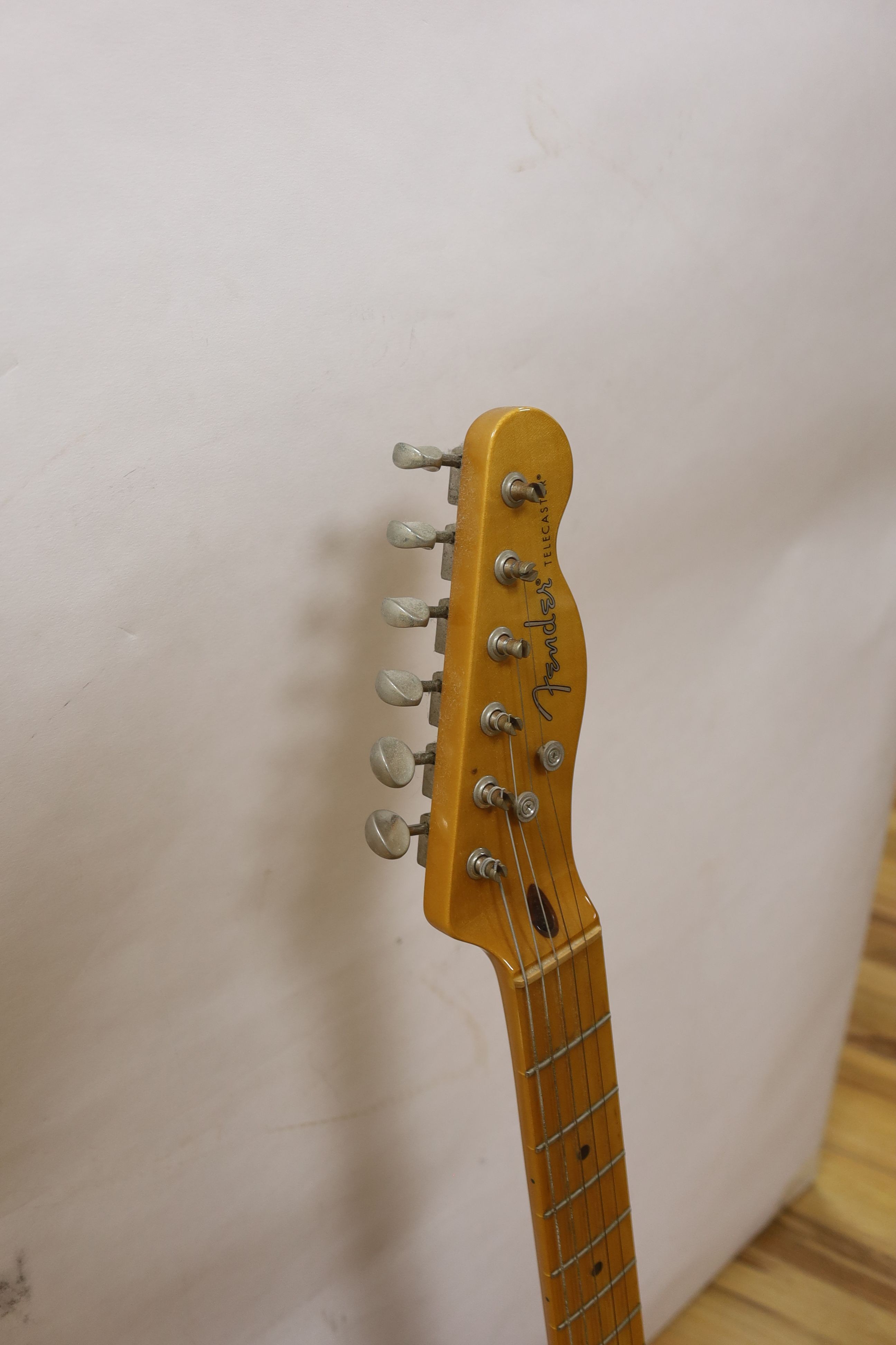 A Fender Telecaster guitar. Serial number CGF1314464